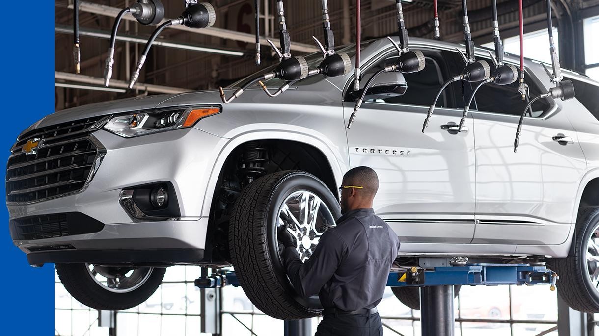 Service employee working on car