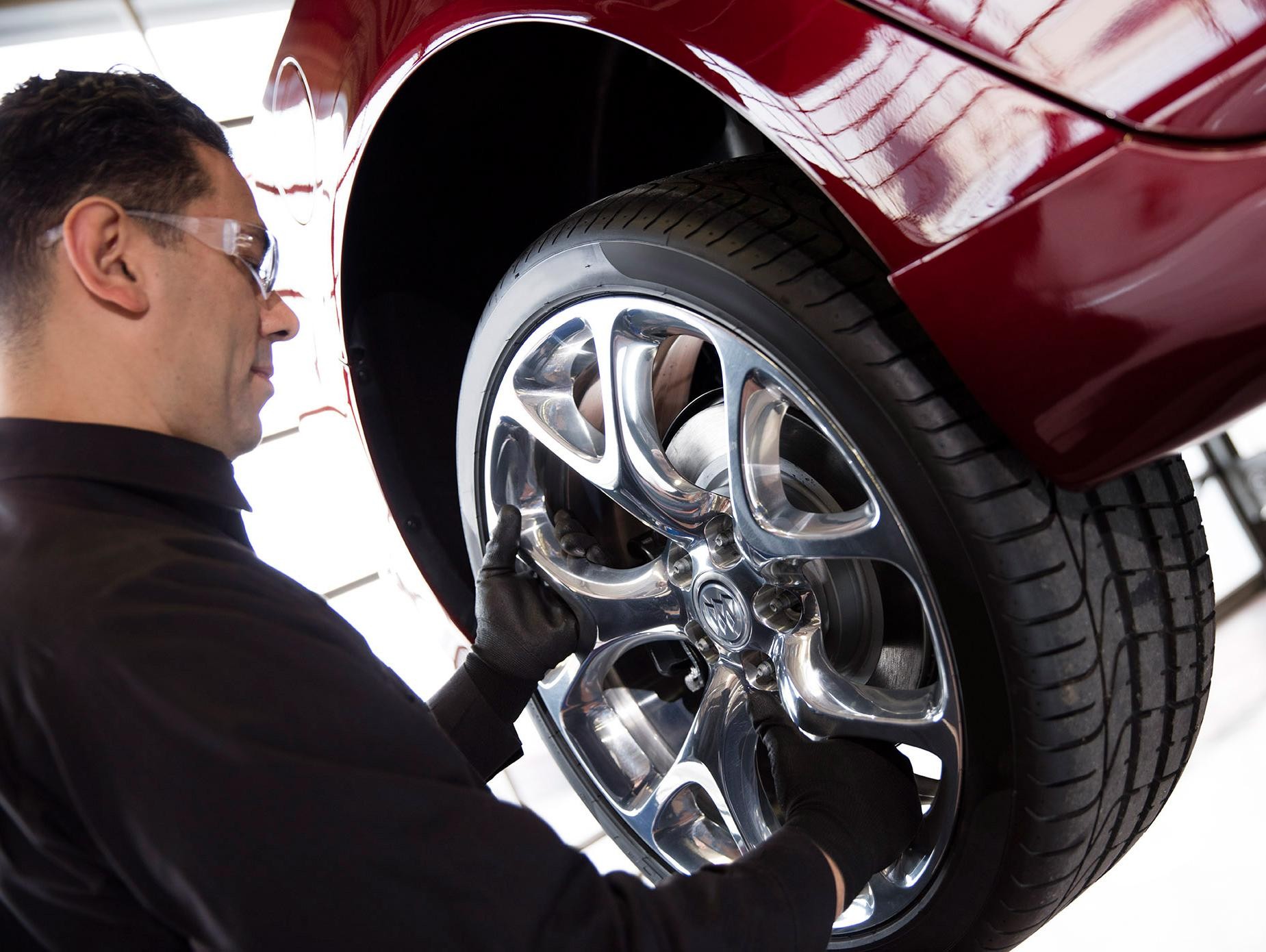 Buick Tech installs tire