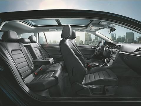 Interior view of 4-door VW vehicle. 