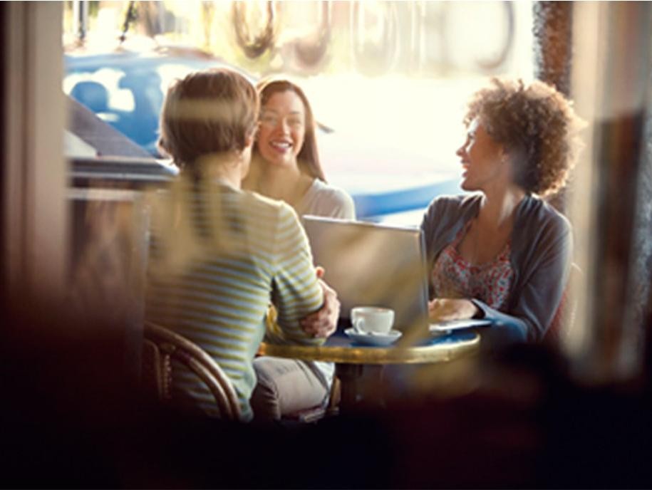 Three women talking at coffee shop