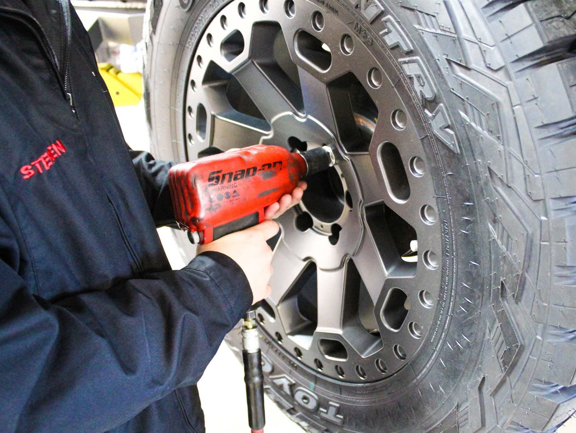 Buick Tech installs tire