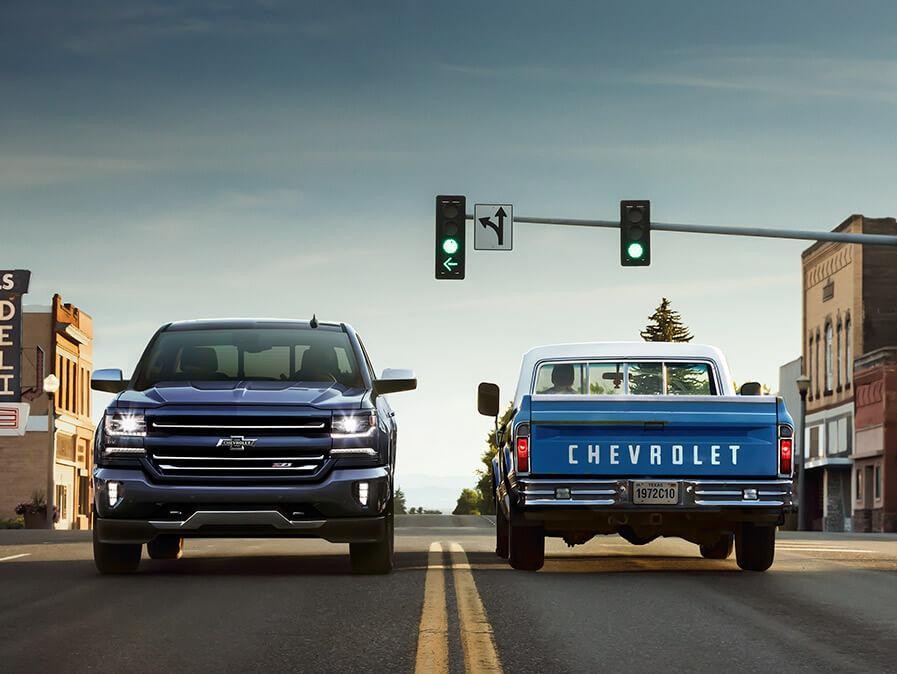 The 2018 Chevy Silverado alongside a 1972 Chevy C10 Truck.