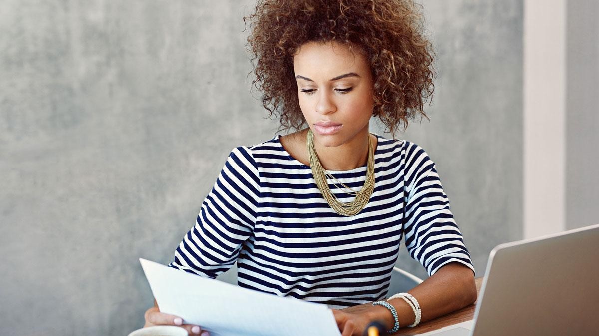 Woman reading paperwork